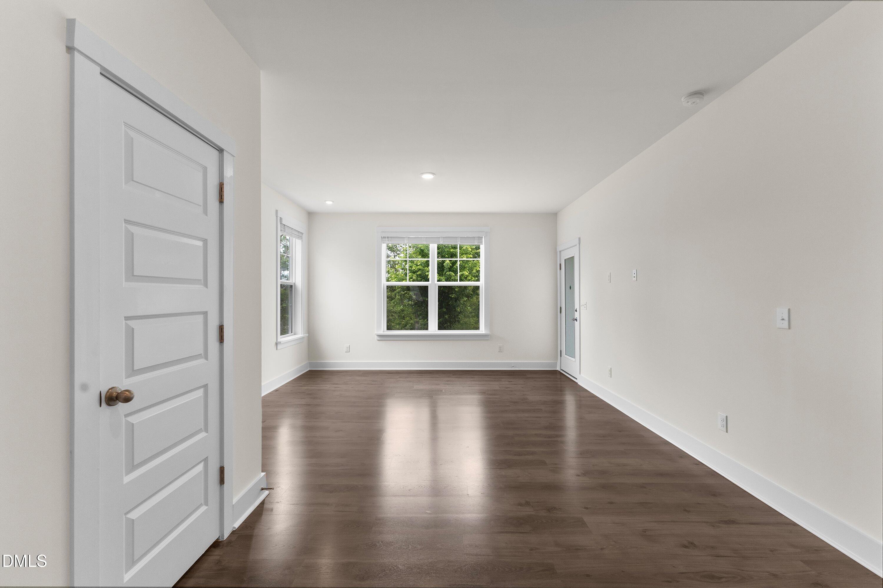 156 Sears Ridge Lane Morrisville, NC 27560 - Photo 11 of 49 wooden floor in an empty room with a window