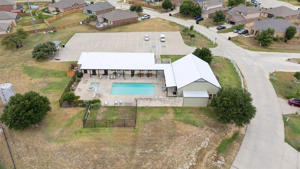 149 Cattlemans Creek Road Newark, TX 76071 - Photo 32 of 39 Community clubhouse, pool and fitness center at 149 Cattlemans Creek Rd in the Chisholm Springs neighborhood in Newark, TX 76071