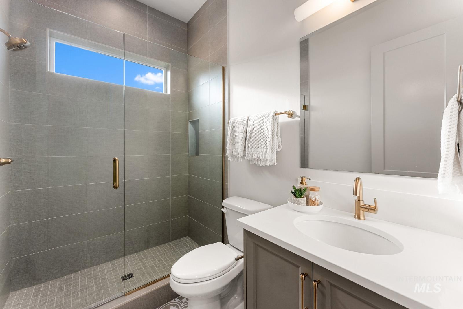 6169 East Prominence Court Boise, ID 83716 - Photo 17 of 43 Full bathroom with vanity and a stall shower