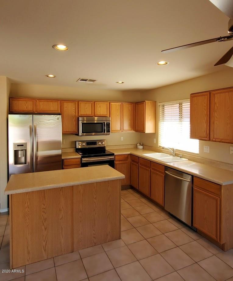 2534 West Maldonado Road Phoenix, AZ 85041 - Photo 8 of 18 2534 W Maldonado island kitchen