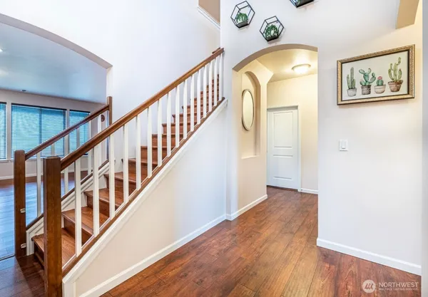a view of an entryway with wooden floor