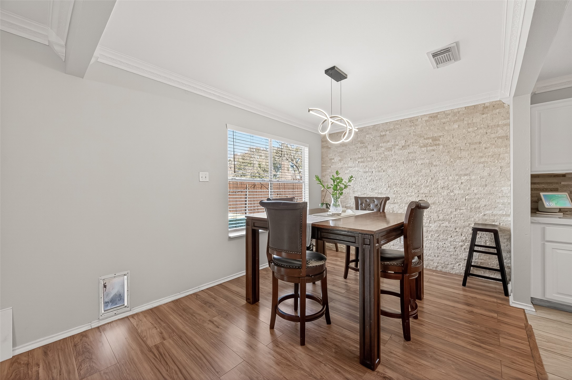 2202 Falling Oaks Road Houston, TX 77038 - Photo 12 of 47 a view of a dining room with furniture window and wooden floor