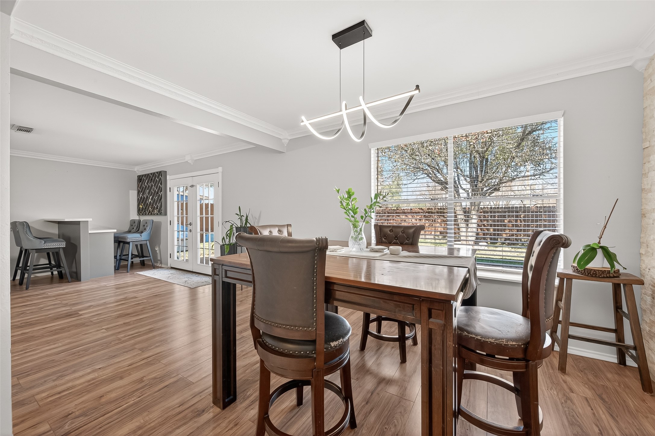 2202 Falling Oaks Road Houston, TX 77038 - Photo 13 of 47 a dining room with furniture window wooden floor