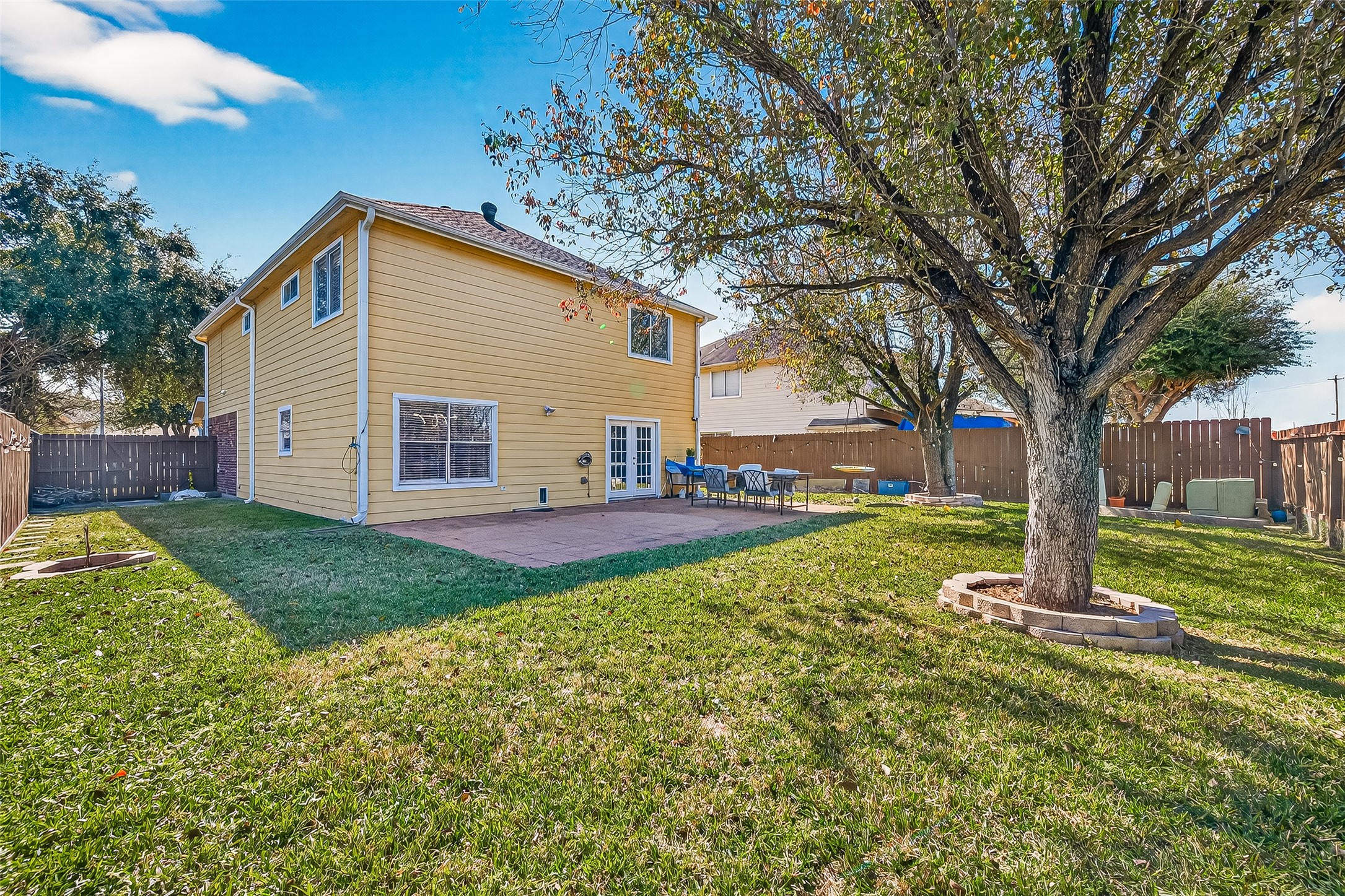 2202 Falling Oaks Road Houston, TX 77038 - Photo 44 of 47 a view of a house with backyard and a tree