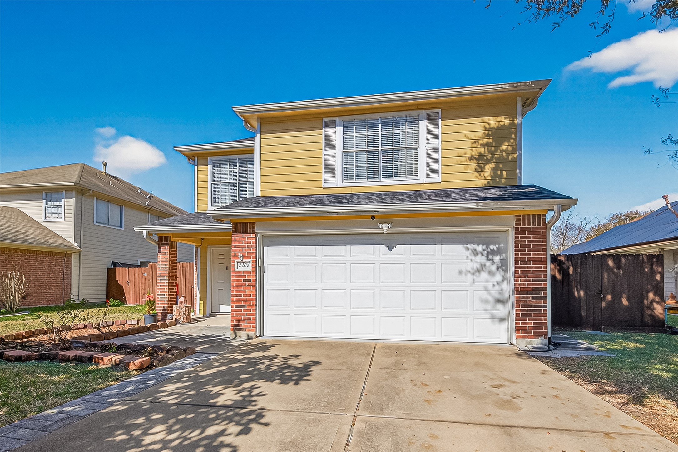 2202 Falling Oaks Road Houston, TX 77038 - Photo 47 of 47 a front view of a house with a yard and garage