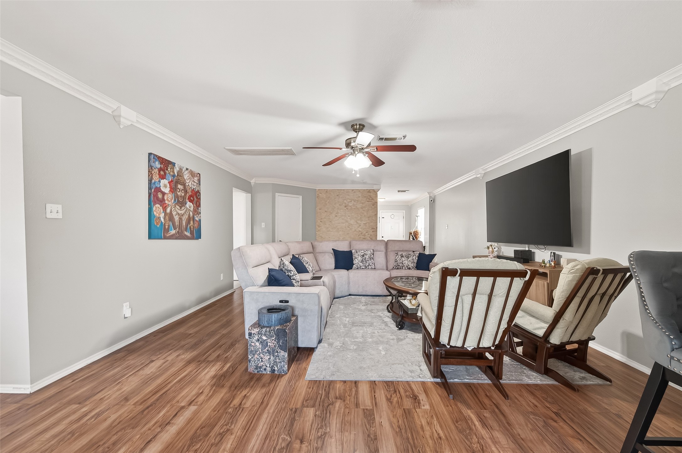 2202 Falling Oaks Road Houston, TX 77038 - Photo 8 of 47 a living room with furniture and a flat screen tv