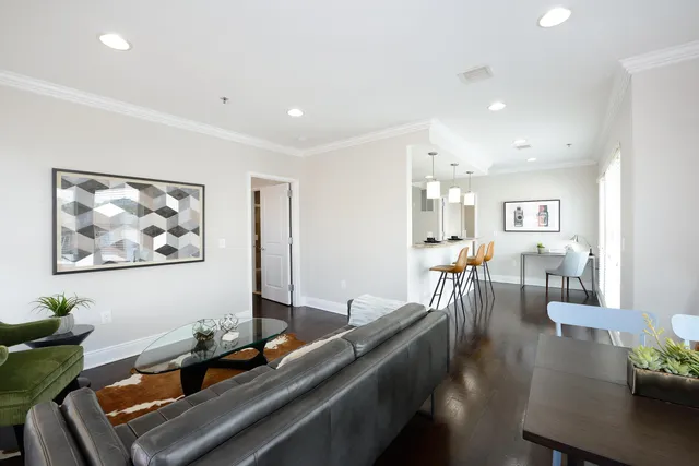 a bathroom with a sink mirror and shower