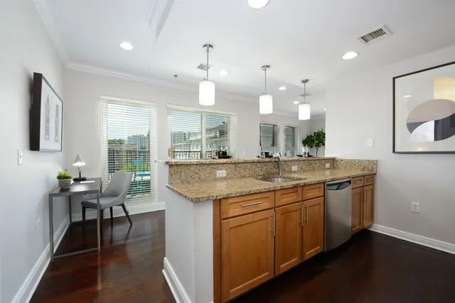 a view of a kitchen counter space and a sink