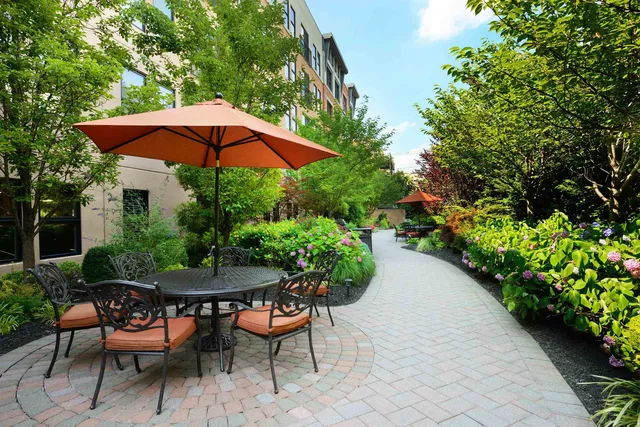 a view of a backyard with sitting area and furniture