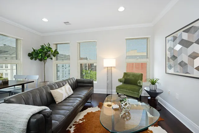 a view of a room with a window and dining table
