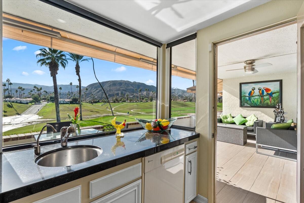 1 Cueta Drive Rancho Mirage, CA 92270 - Photo 13 of 39 a kitchen with a large window and sink