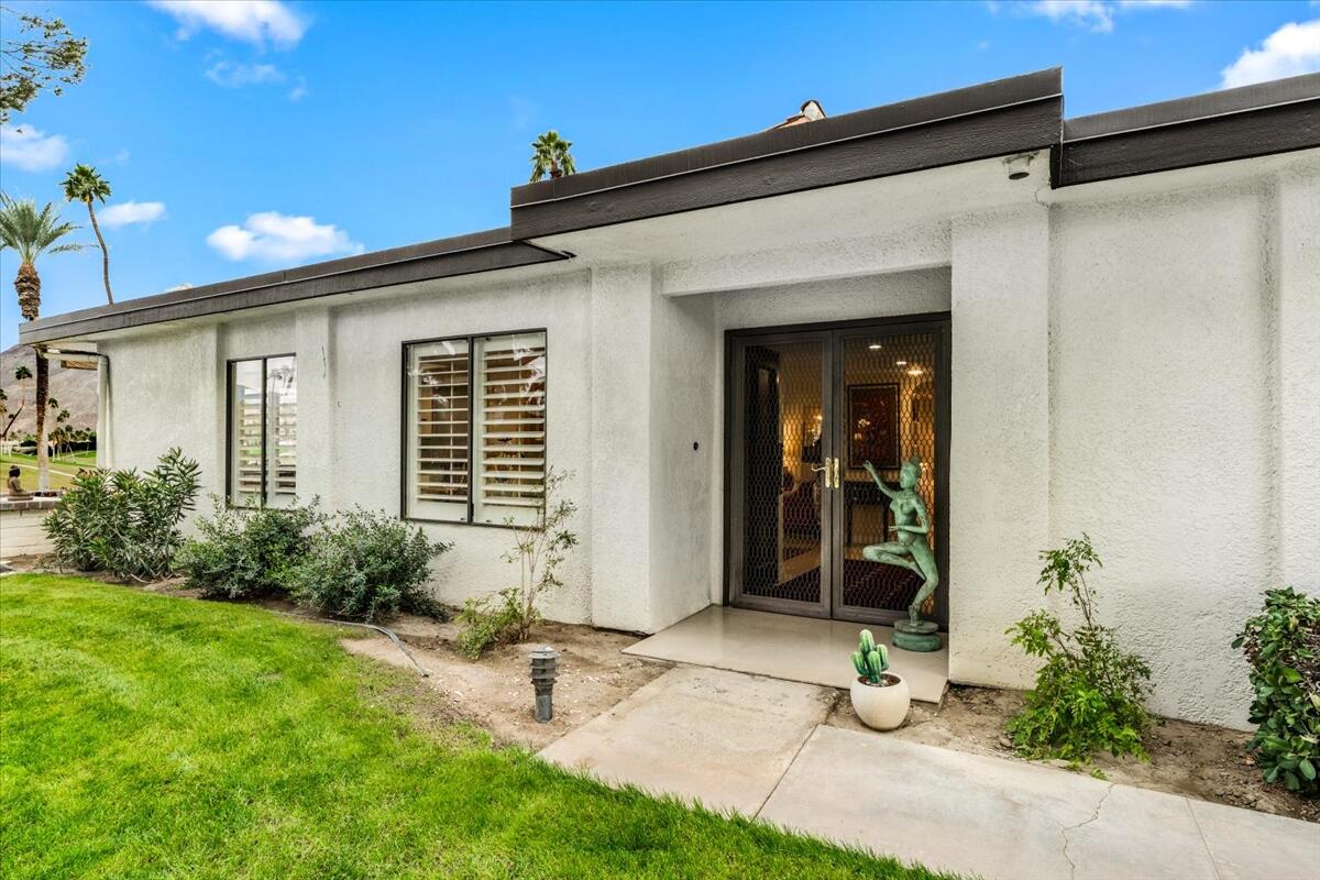 1 Cueta Drive Rancho Mirage, CA 92270 - Photo 2 of 39 a front view of a house with garden