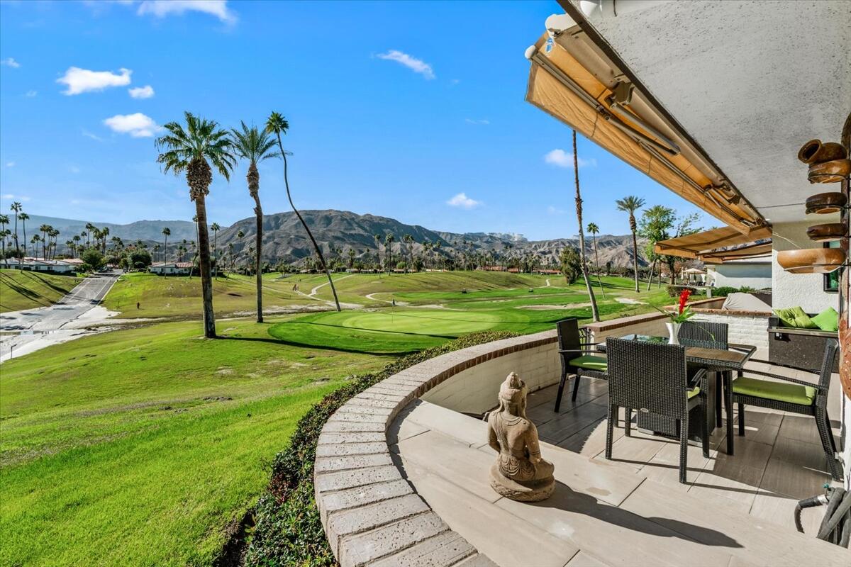 1 Cueta Drive Rancho Mirage, CA 92270 - Photo 25 of 39 a view of a swimming pool with a deck and a garden