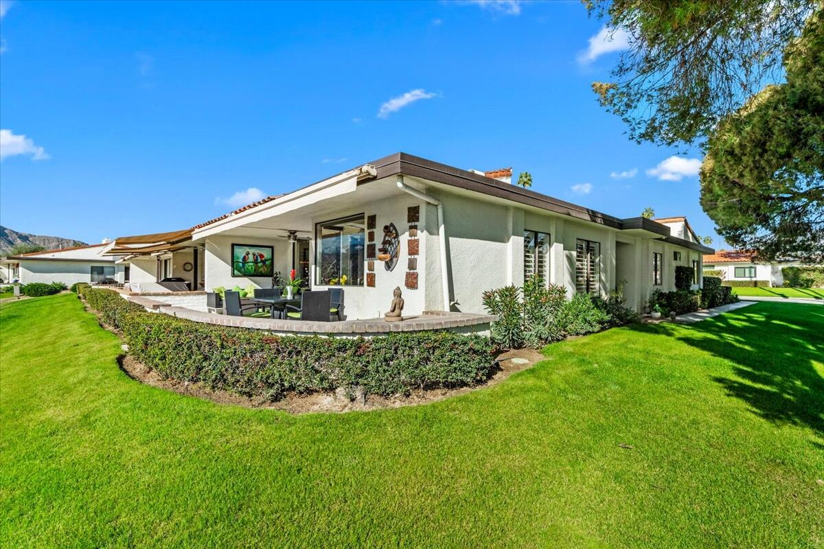 1 Cueta Drive Rancho Mirage, CA 92270 - Photo 28 of 39 a front view of a house with garden