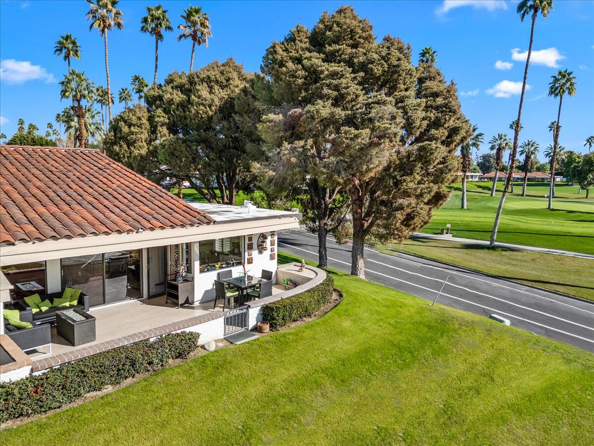 1 Cueta Drive Rancho Mirage, CA 92270 - Photo 29 of 39 a view of a house with swimming pool and porch with furniture