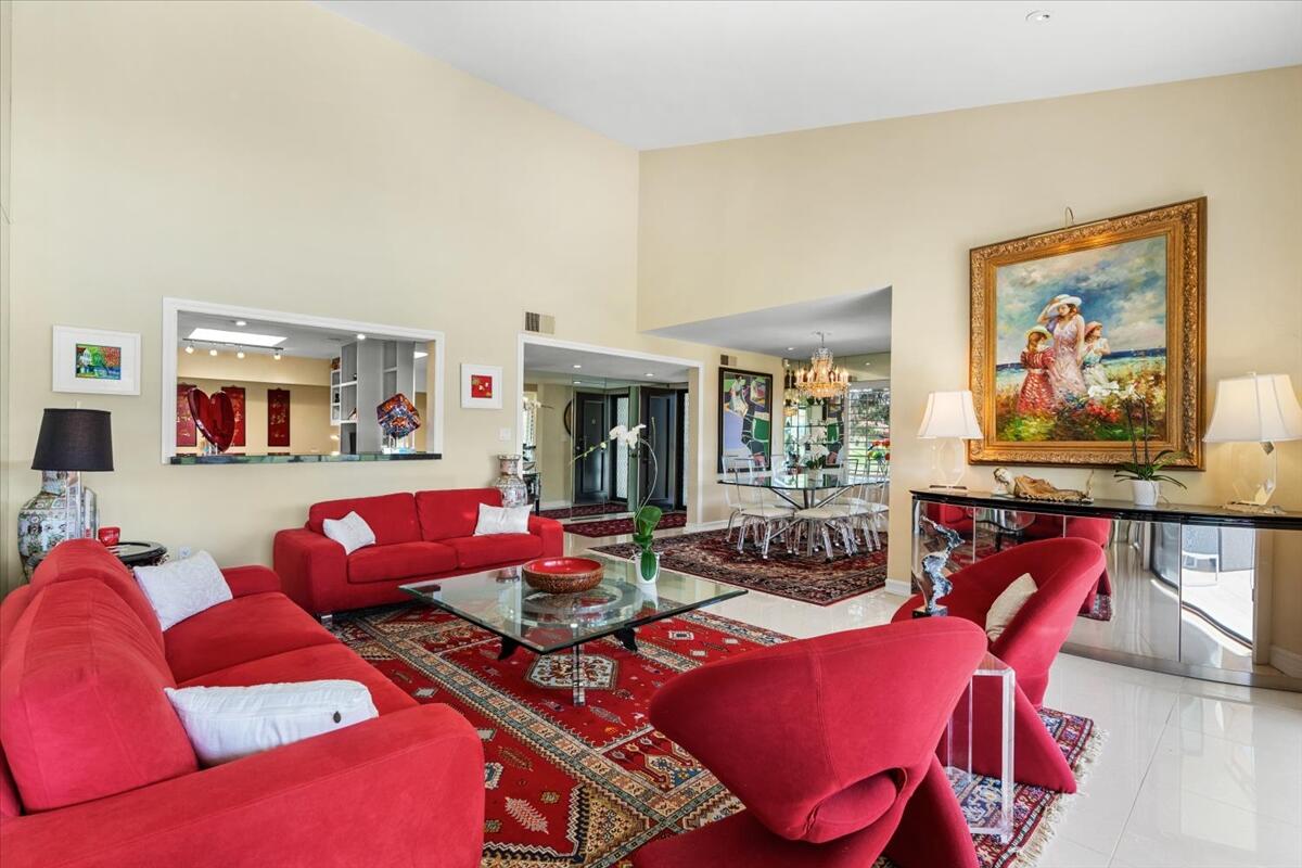 1 Cueta Drive Rancho Mirage, CA 92270 - Photo 6 of 39 a living room with furniture a red rug and a window