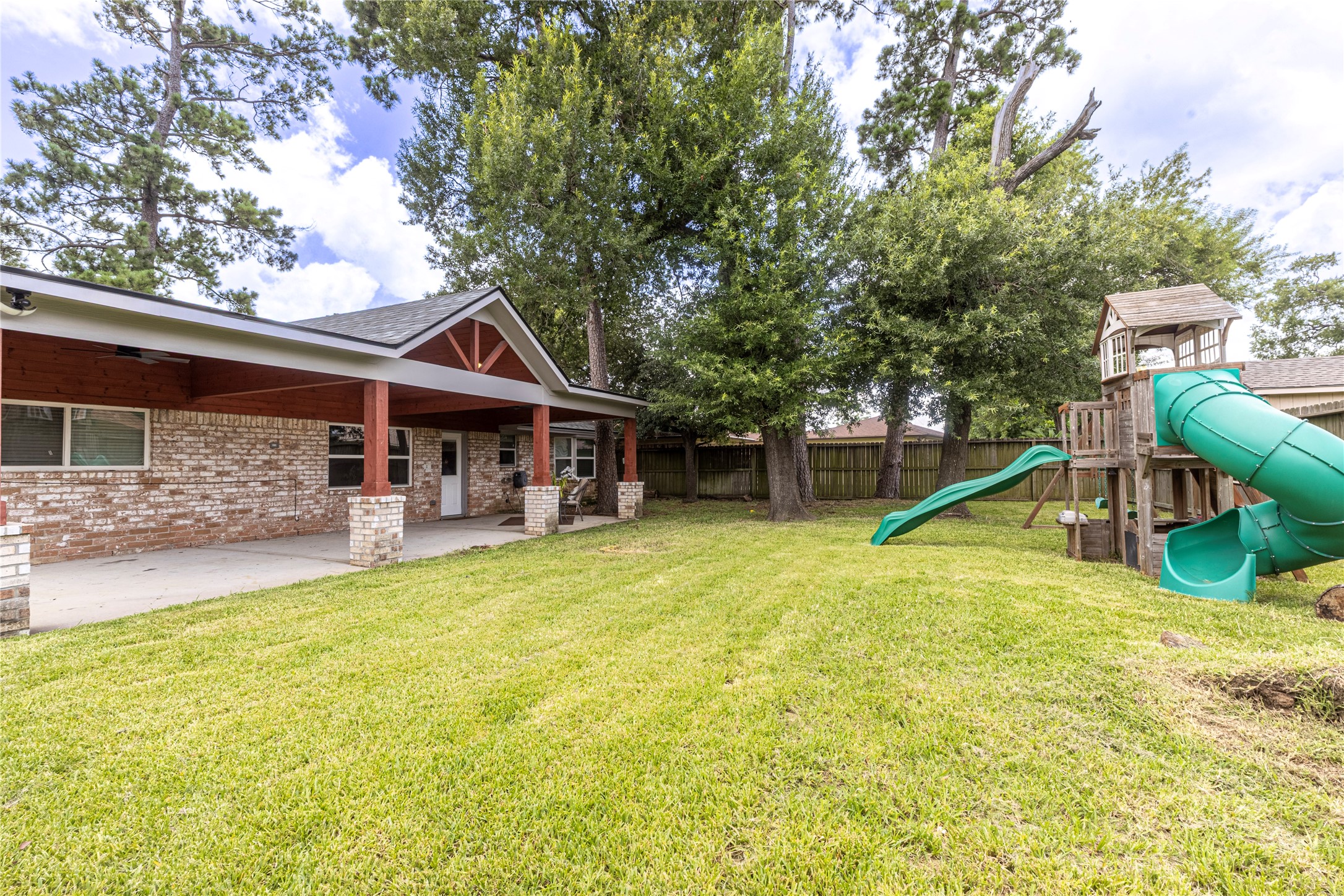 14419 Wadebridge Way Houston, TX 77015 - Photo 17 of 20 Come make this relaxing backyard yours today! The playground stays with the home! , it offers privacy and a great space for outdoor activities.