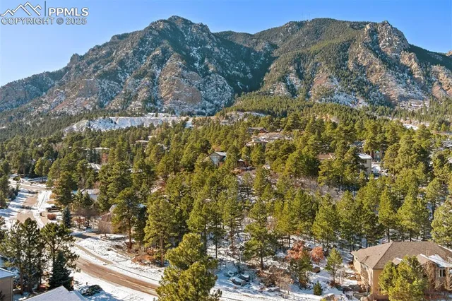 a view of a large building with a mountain in the background