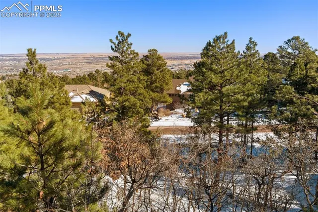 a view of outdoor space with wooden fence