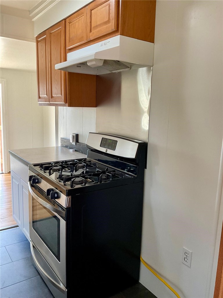1180 Starlite Drive Nipomo, CA 93444 - Photo 12 of 35 a stove top oven sitting inside of a kitchen