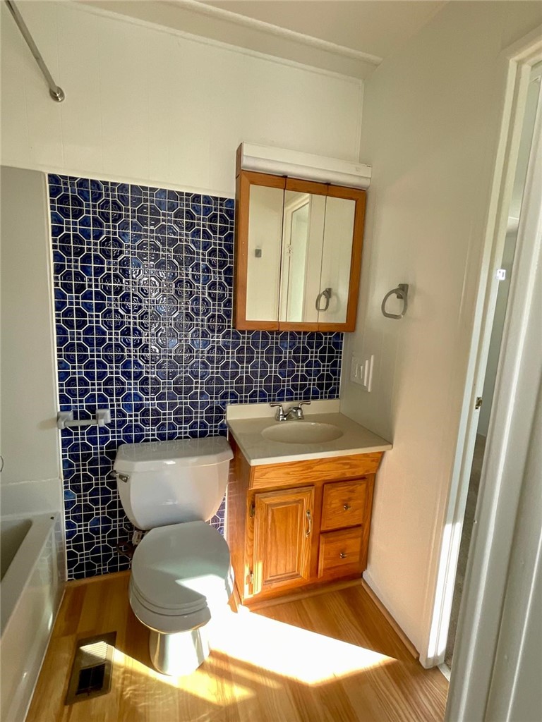 1180 Starlite Drive Nipomo, CA 93444 - Photo 13 of 35 a bathroom with a toilet a sink and a mirror