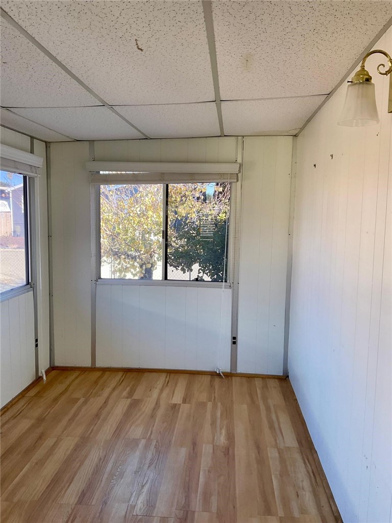 1180 Starlite Drive Nipomo, CA 93444 - Photo 15 of 35 an empty room with wooden floor and windows