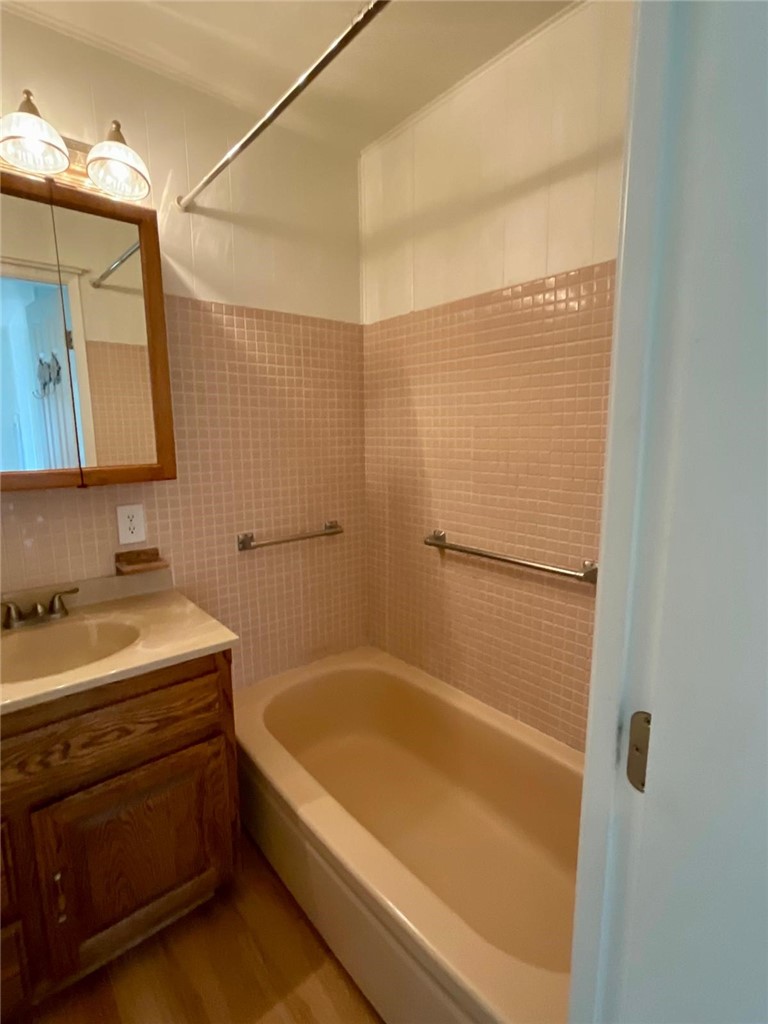 1180 Starlite Drive Nipomo, CA 93444 - Photo 16 of 35 a bathroom with a tub a sink and a shower