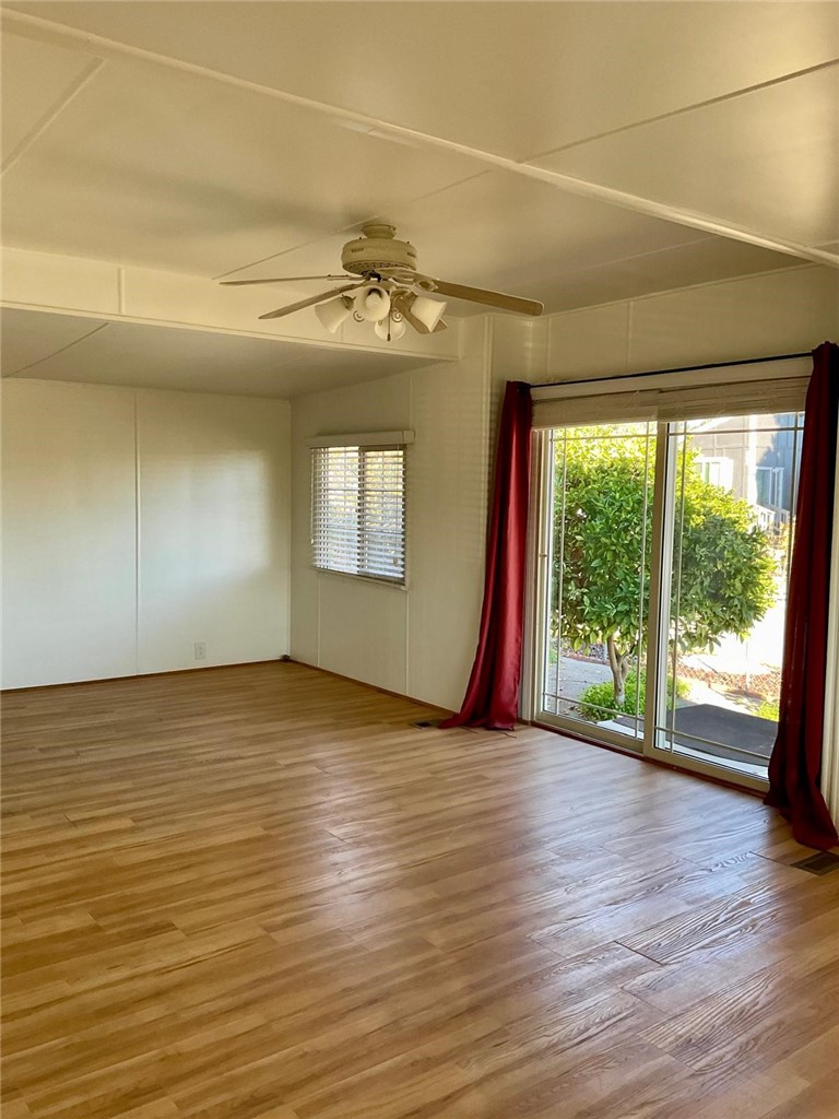 1180 Starlite Drive Nipomo, CA 93444 - Photo 5 of 35 an empty room with wooden floor and windows