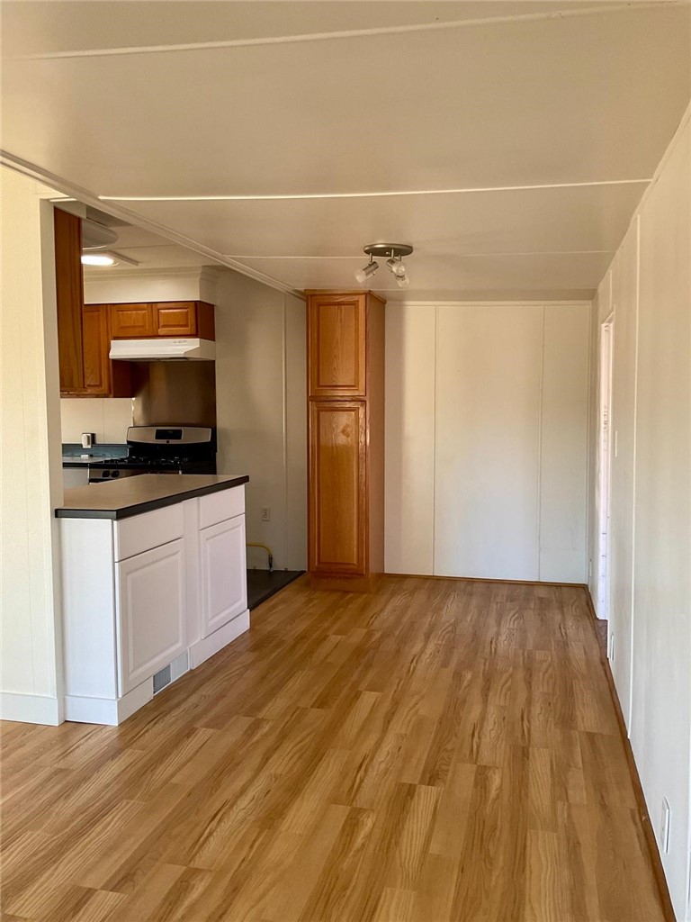 1180 Starlite Drive Nipomo, CA 93444 - Photo 7 of 35 a view of a kitchen with microwave and cabinets