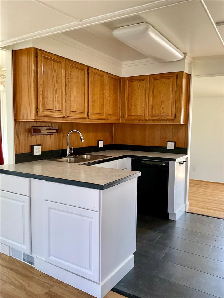 1180 Starlite Drive Nipomo, CA 93444 - Photo 9 of 35 a kitchen with stainless steel appliances granite countertop a sink and a cabinets