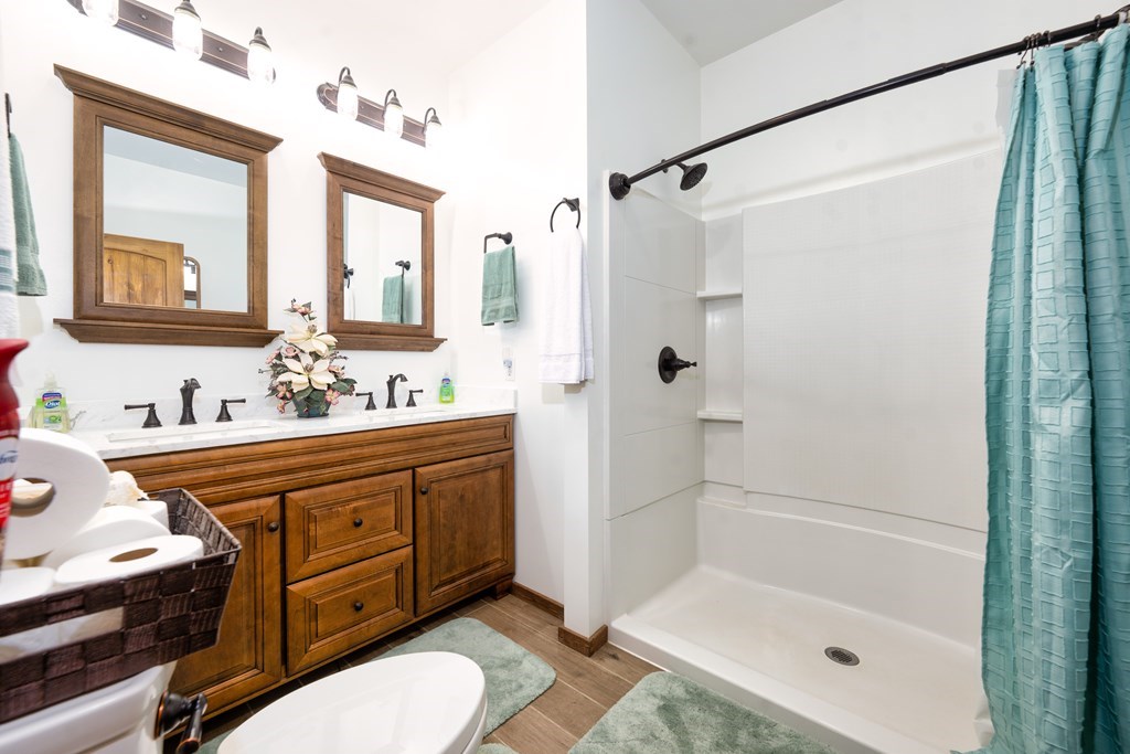 3234 Winding Stairs Road Topton, NC 28781 - Photo 13 of 32 a bathroom with a sink mirror vanity and toilet