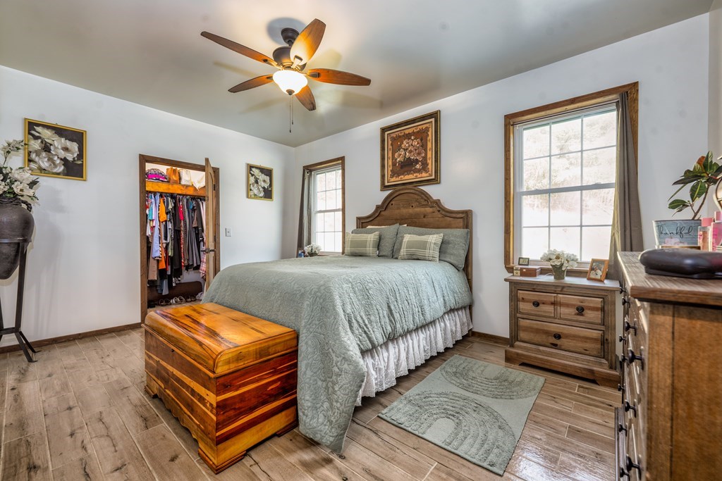 3234 Winding Stairs Road Topton, NC 28781 - Photo 14 of 32 a bedroom with a bed and a chandelier