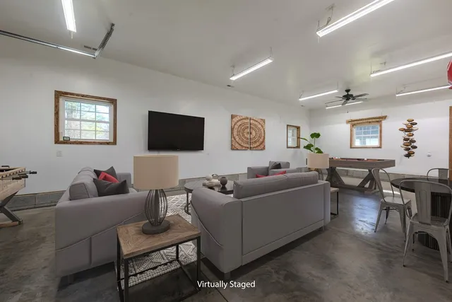 an empty room with a empty space and windows