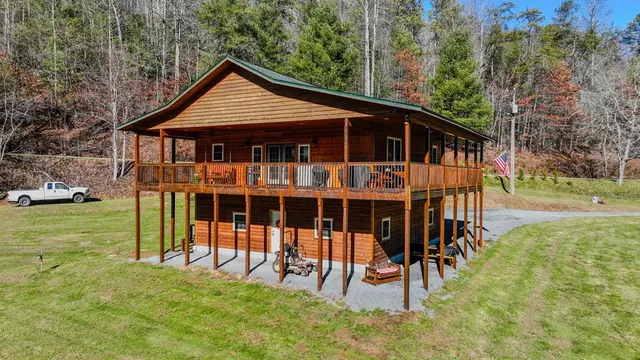 a view of a house with backyard porch and sitting area