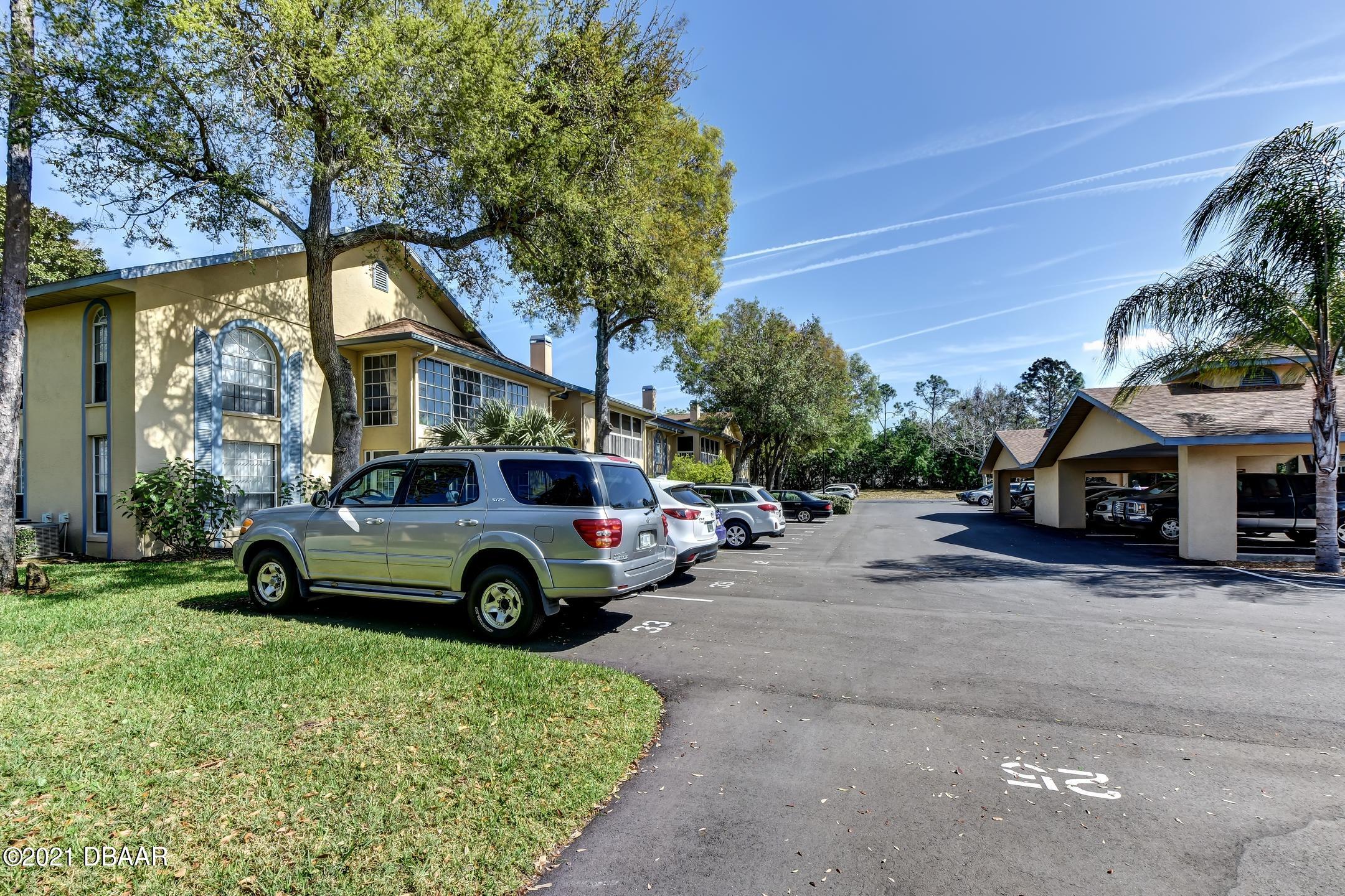 681 Wellington Station Boulevard, Unit 4 Ormond Beach, FL 32174 - Photo 21 of 27 23-Parking Area