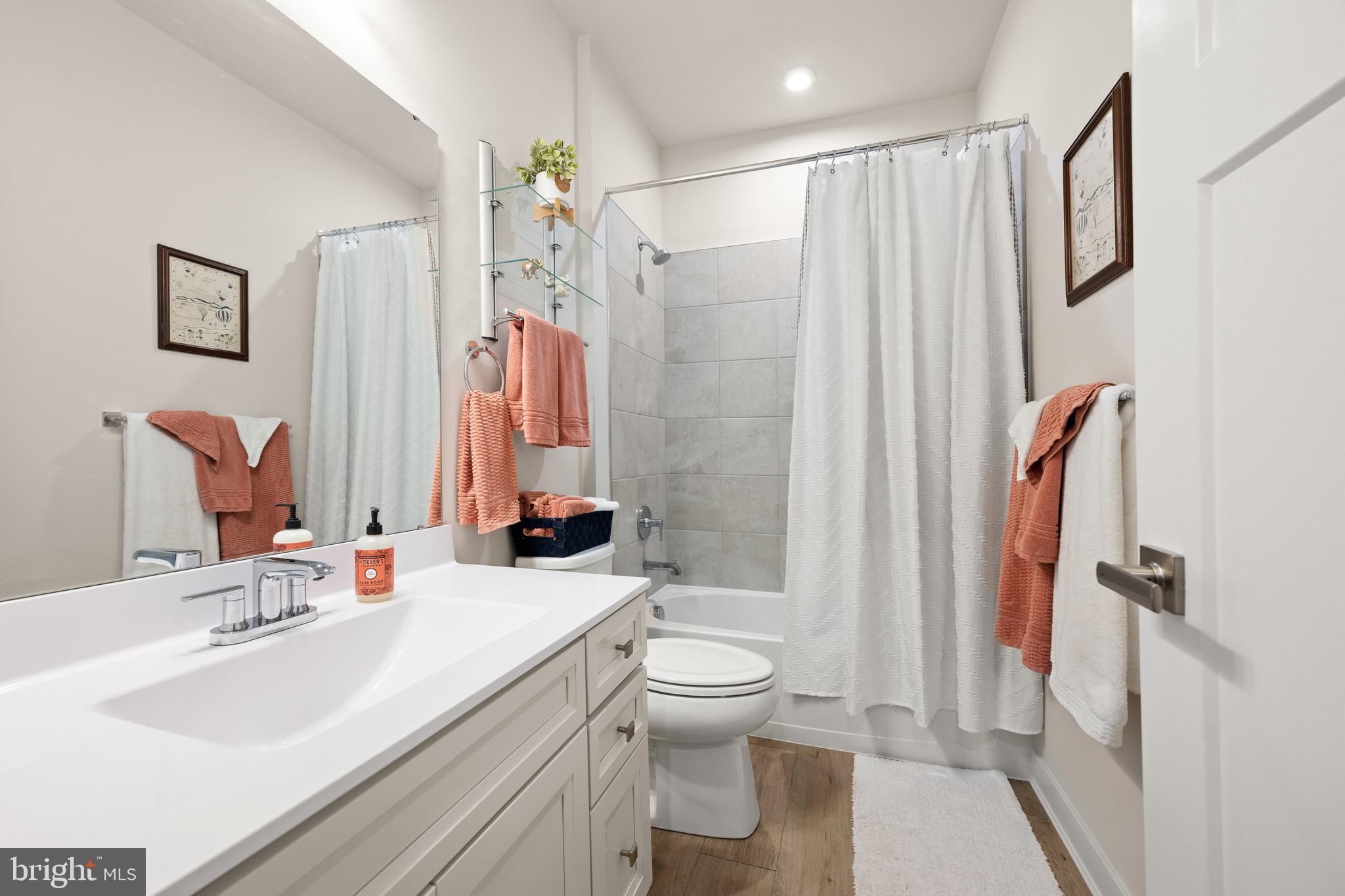 30478 Indigo Way Georgetown, DE 19947 - Photo 20 of 41 a bathroom with a double vanity sink toilet and shower
