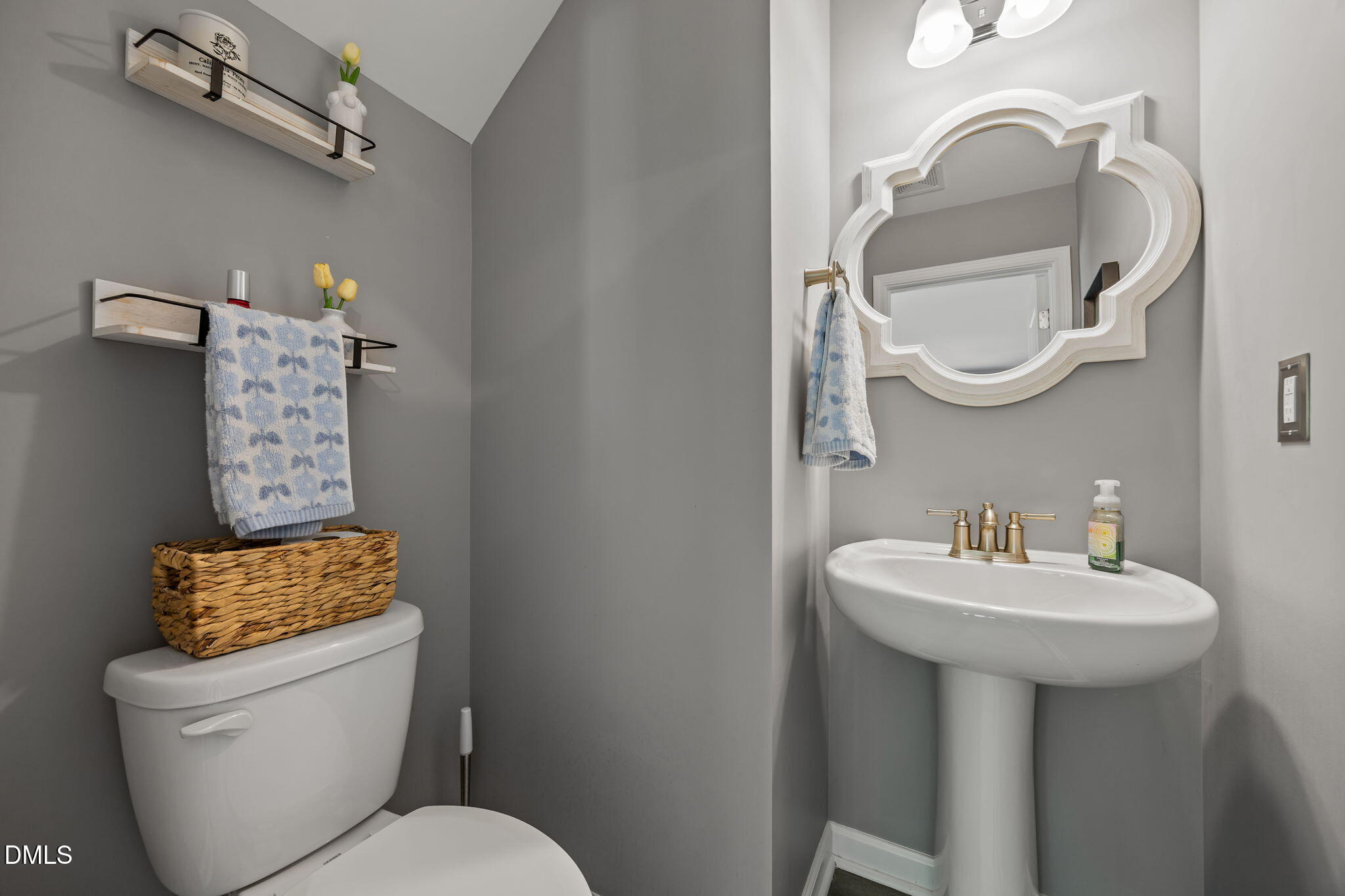 1108 Felman Road Durham, NC 27703 - Photo 12 of 28 a bathroom with a toilet sink and mirror