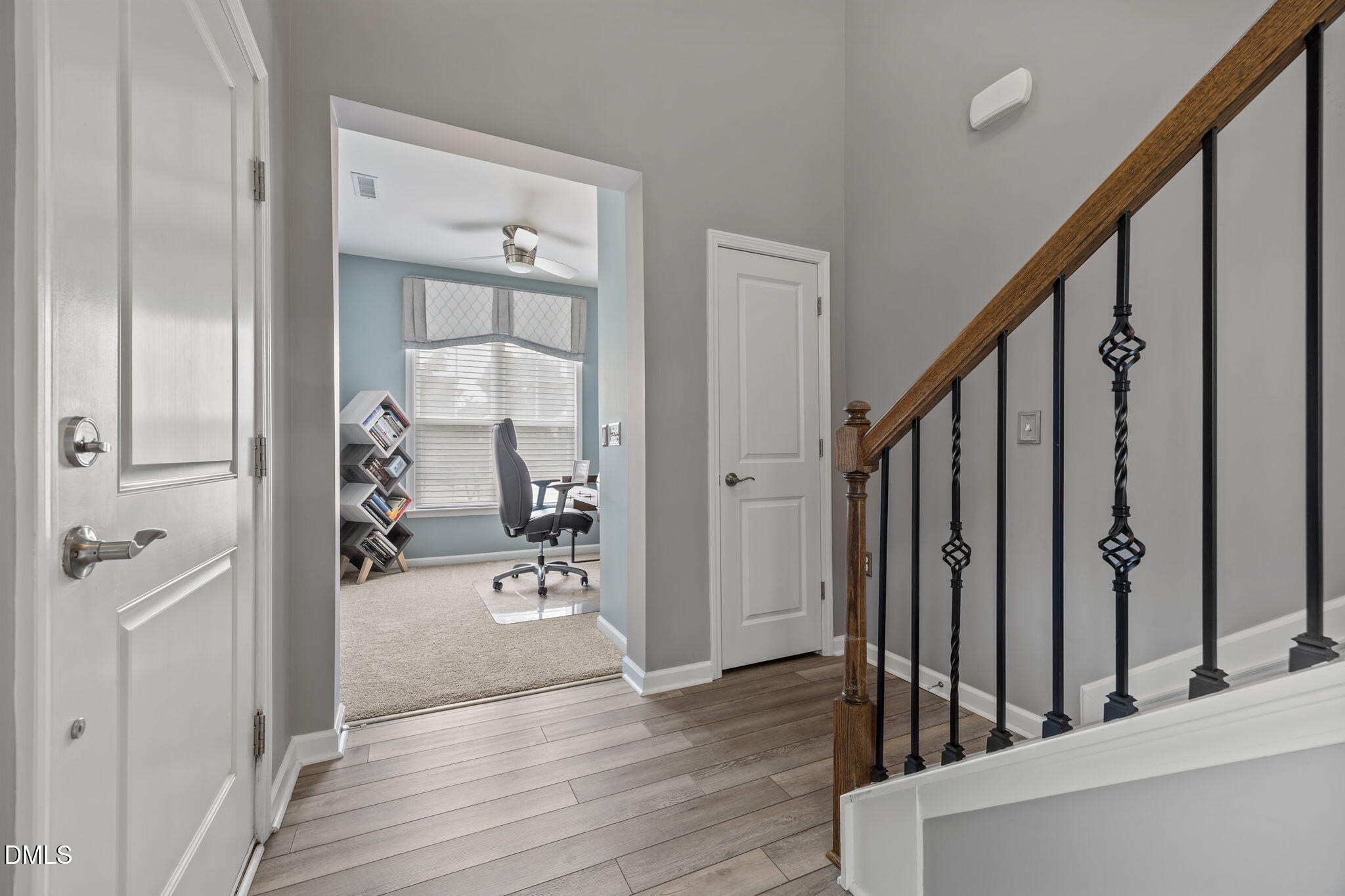 1108 Felman Road Durham, NC 27703 - Photo 14 of 28 a view of a hallway with wooden floor and staircase
