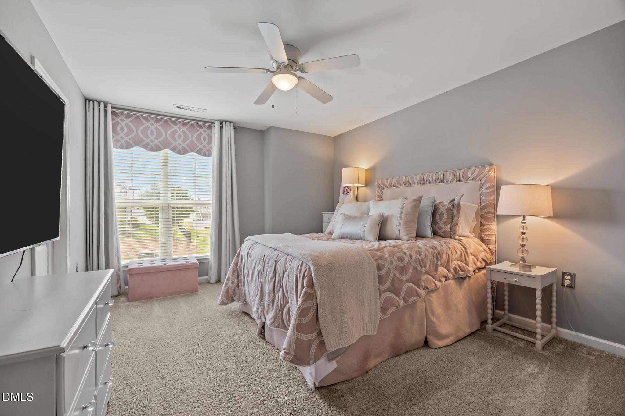 1108 Felman Road Durham, NC 27703 - Photo 22 of 28 a bedroom with a bed and a large window