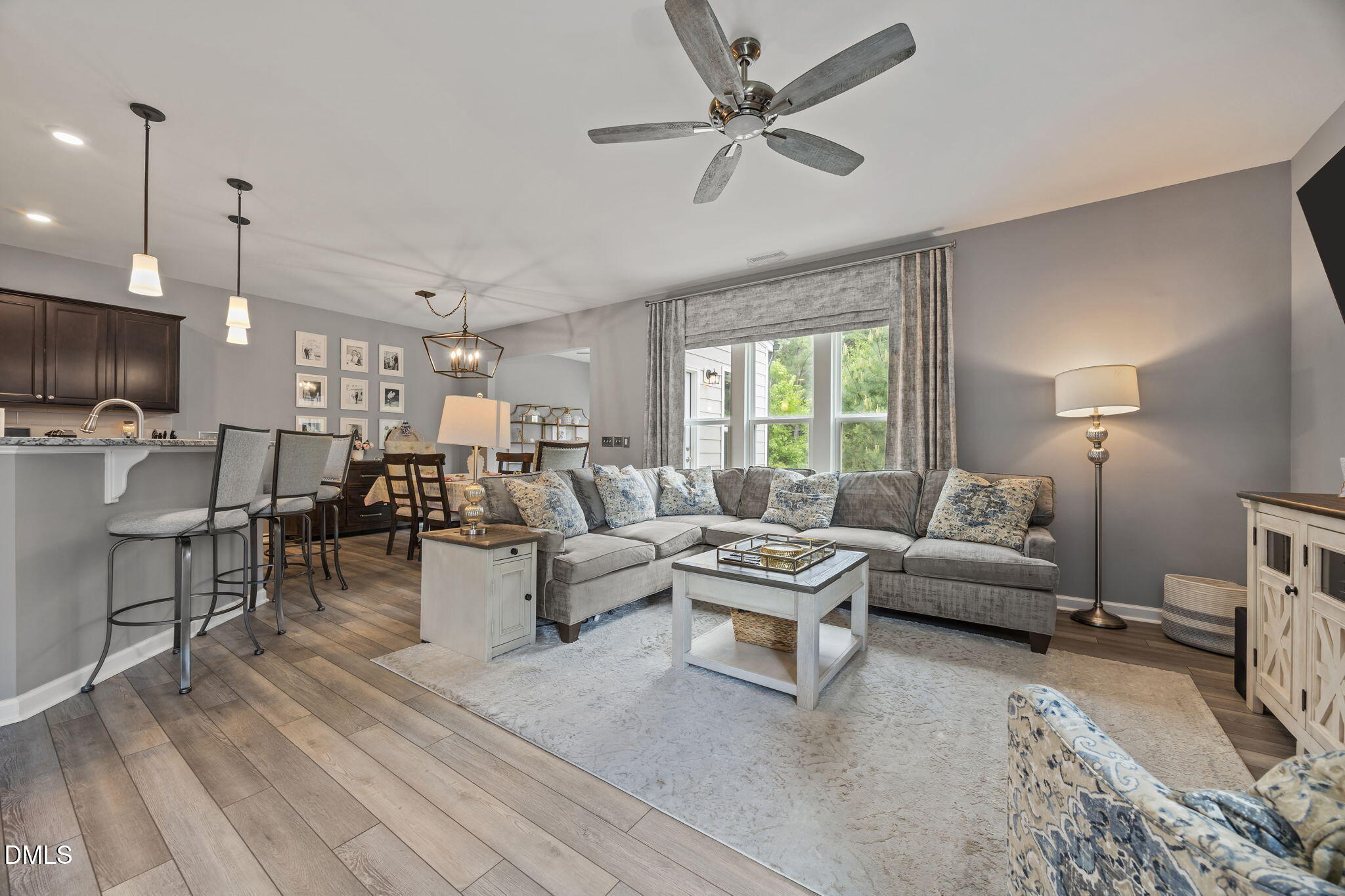 1108 Felman Road Durham, NC 27703 - Photo 4 of 28 a living room with lots of furniture and a chandelier