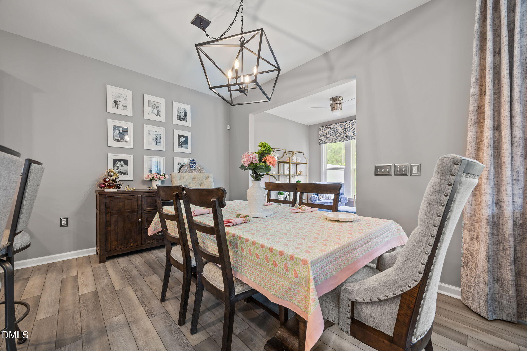 1108 Felman Road Durham, NC 27703 - Photo 5 of 28 a view of a dining room with furniture and wooden floor
