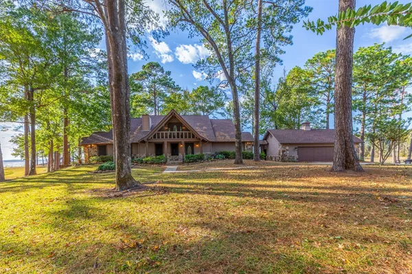 a view of a house with a large trees