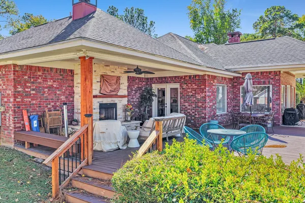 a front view of house with outdoor seating and barbeque oven