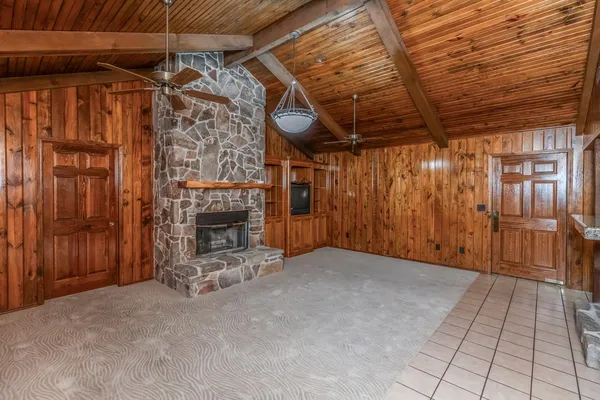 a view of a room with wooden walls