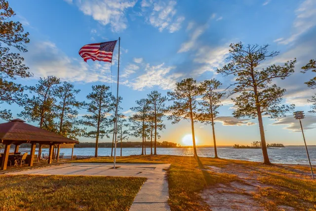 a sign board with yard and ocean view