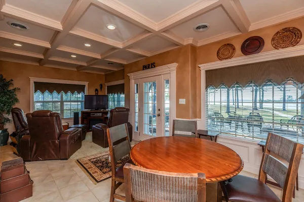 a view of a dining room with furniture window and outside view