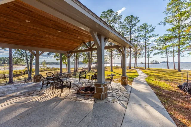a view of swimming pool with outdoor seating