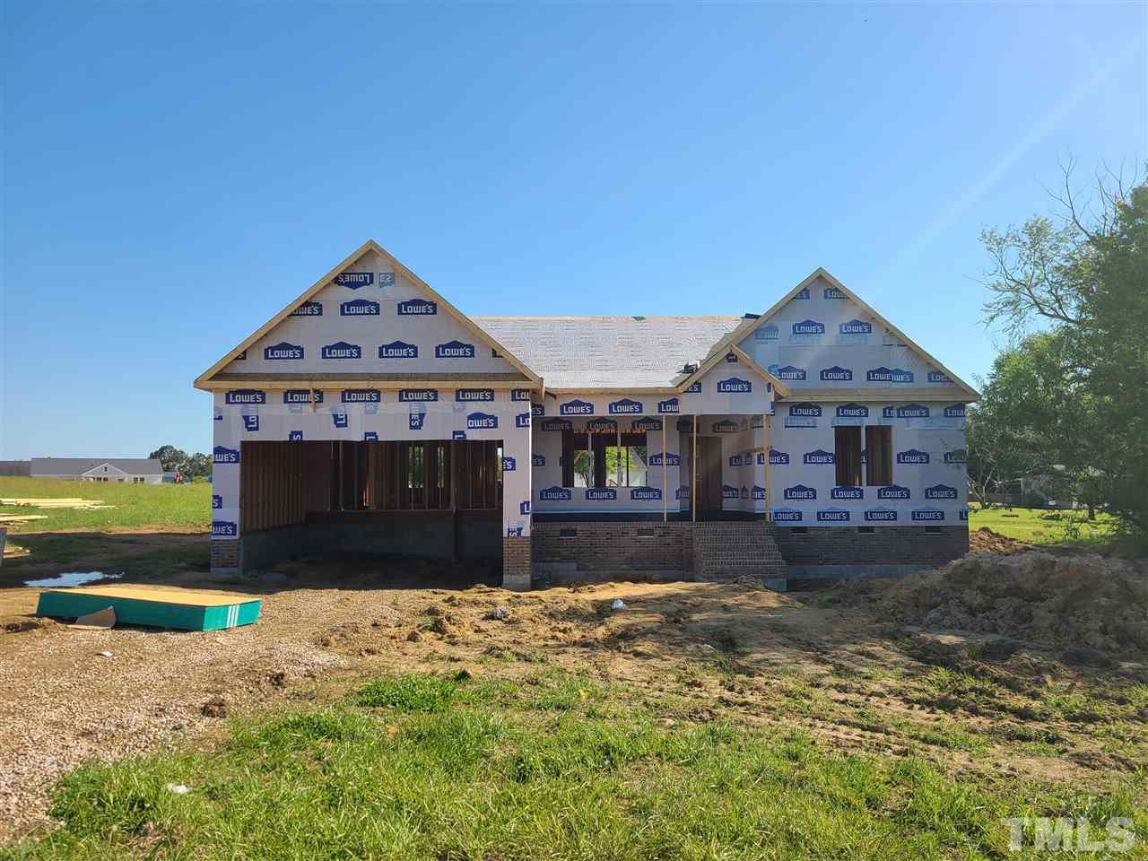 7149 Hill Road Spring Hope, NC 27882 - Photo 1 of 21 a front view of a house with a yard