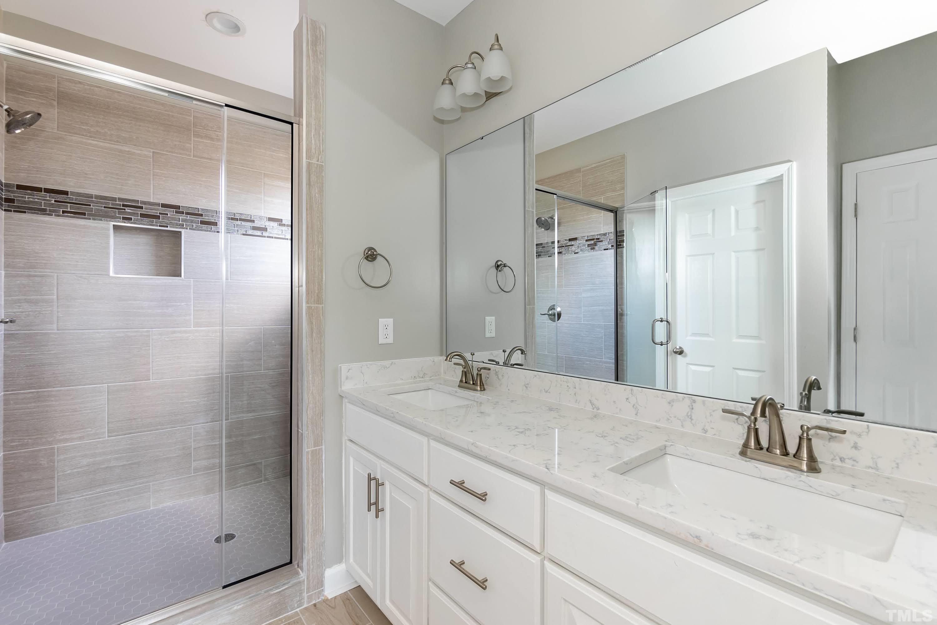 7149 Hill Road Spring Hope, NC 27882 - Photo 20 of 21 a bathroom with a granite countertop sink mirror and shower