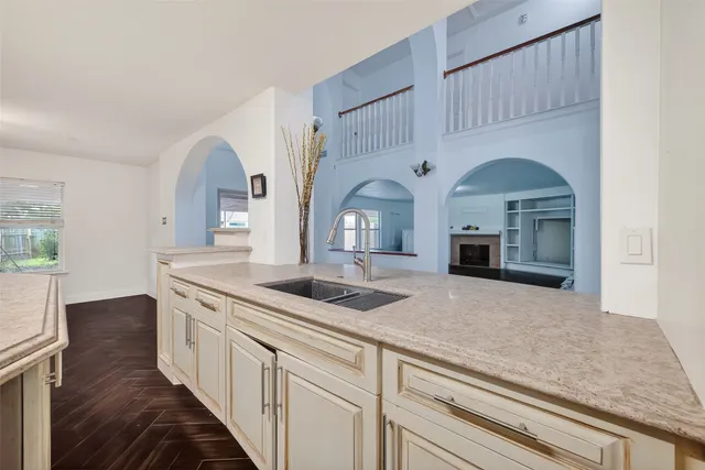 a view of living room with granite countertop furniture and fireplace